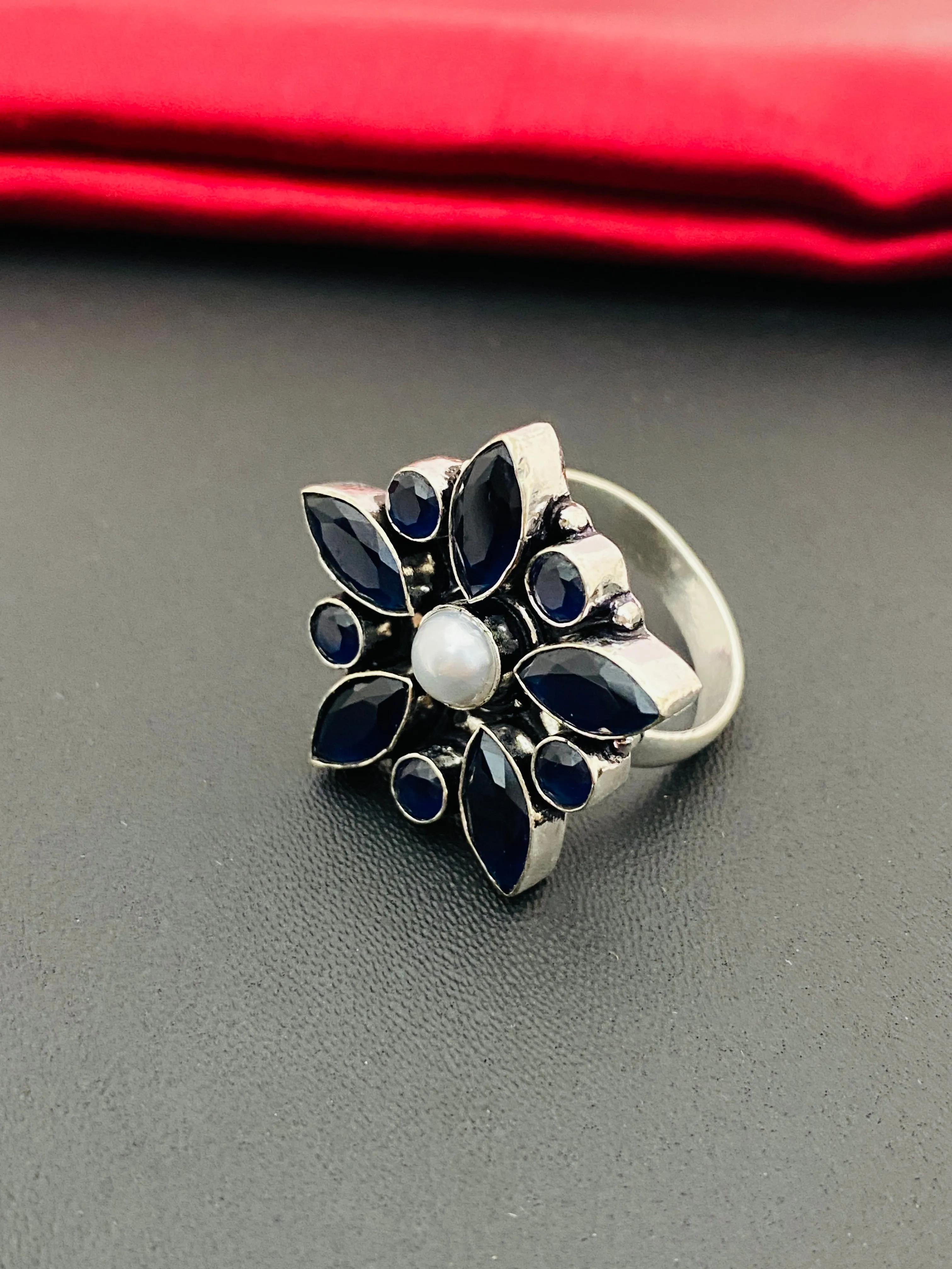 Alluring Black Stone Studded Floral Designed Adjustable Rings With Pearl Bead